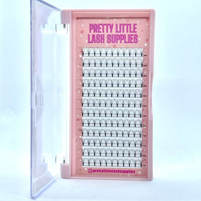 Pink lash extension tray with clear cover, featuring individual black lashes in various lengths and styles.