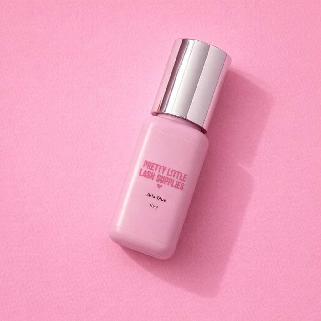 Pretty Little Lash Supplies Aria Glue, 10ml, pink bottle with silver cap, ideal for lash extensions.