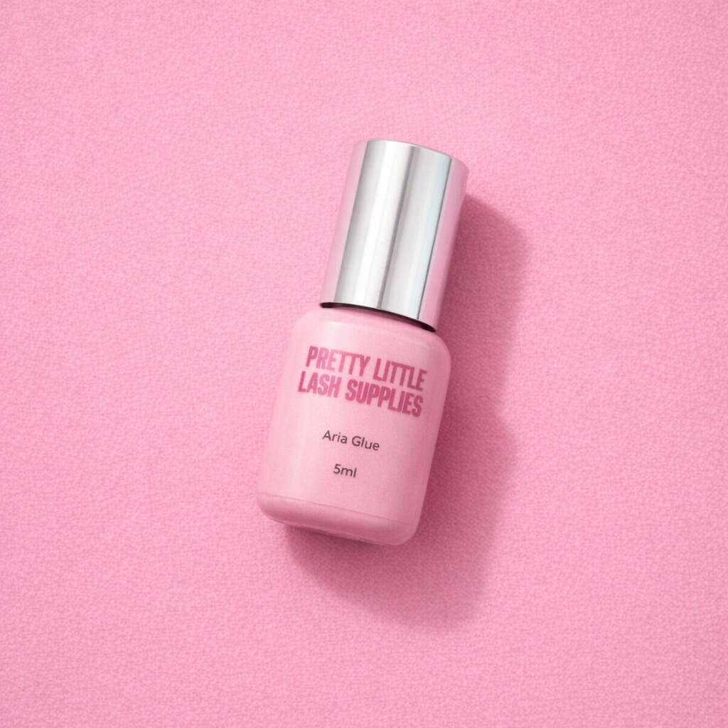 Pretty Little Lash Supplies Aria Glue, 5ml, pink bottle with silver cap, ideal for eyelash extensions.