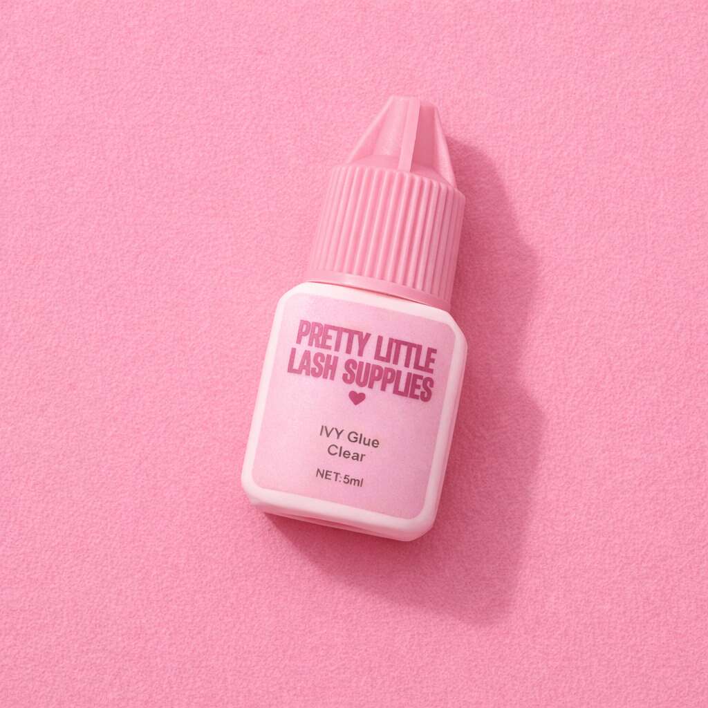 Pretty Little Lash Supplies IVY Clear Glue, 5ml, pink packaging on a soft pink background, perfect for lash extensions.