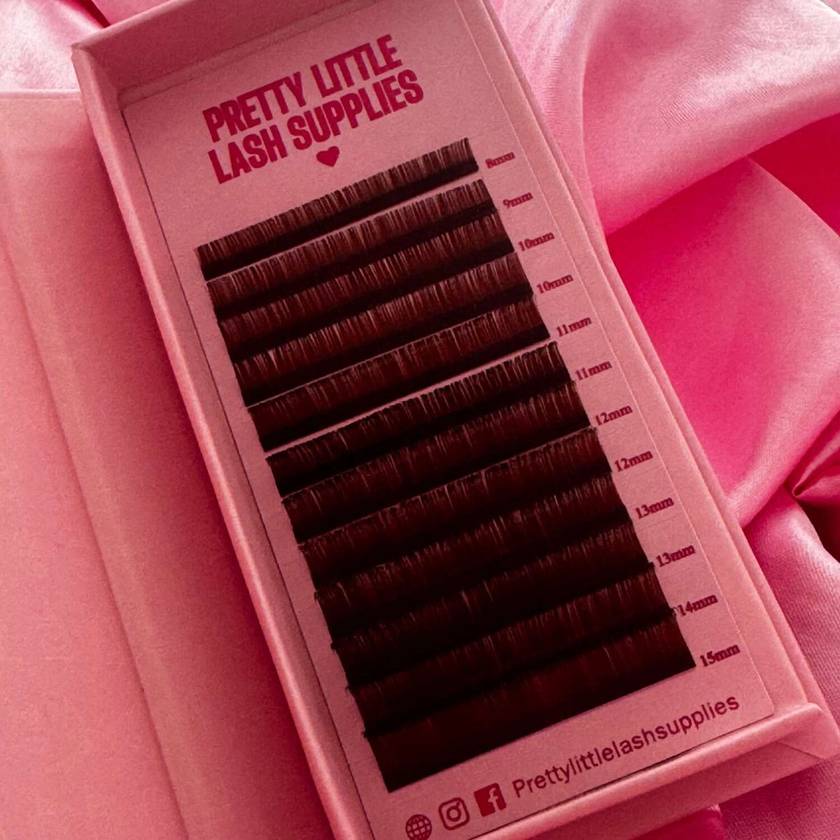Brown lash extensions in lengths from 8mm to 15mm, neatly arranged in a pink box for easy access.
