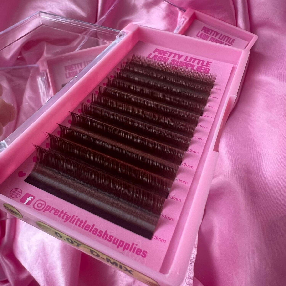 D-mix dark brown eyelash extensions in a pink tray, featuring various lengths from 8mm to 14mm.