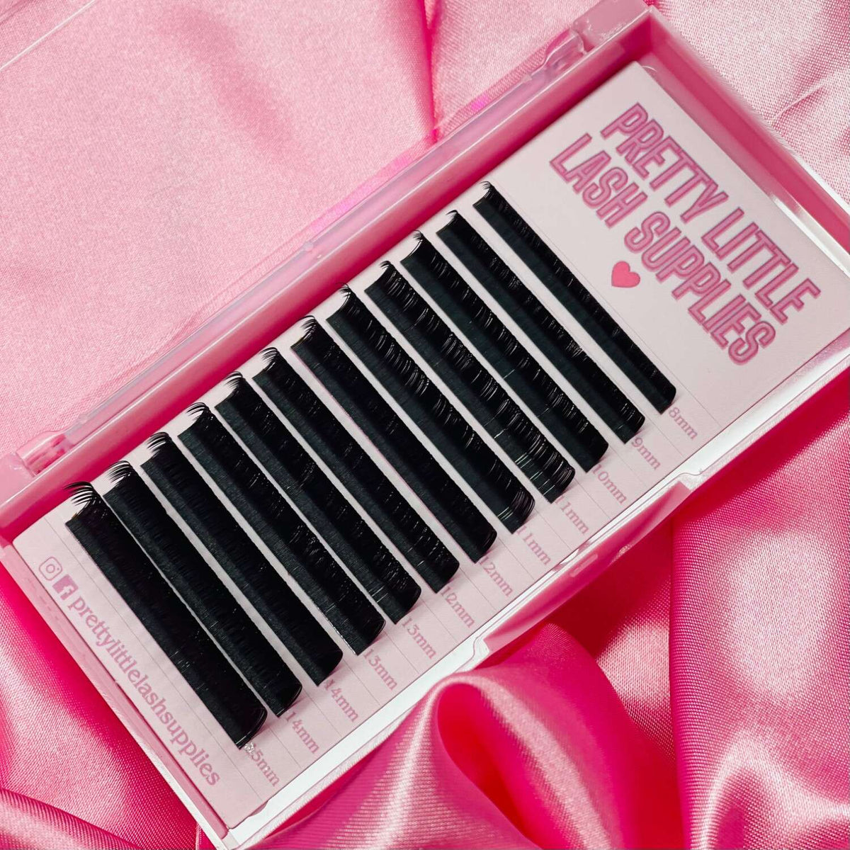 Black faux mink eyelash extensions in a clear case, featuring 12 varying lengths for customized lash looks.