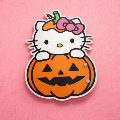 Hello Kitty Halloween pumpkin lash tile in vibrant orange and pink, made from durable plastic. Perfect for lash techs.