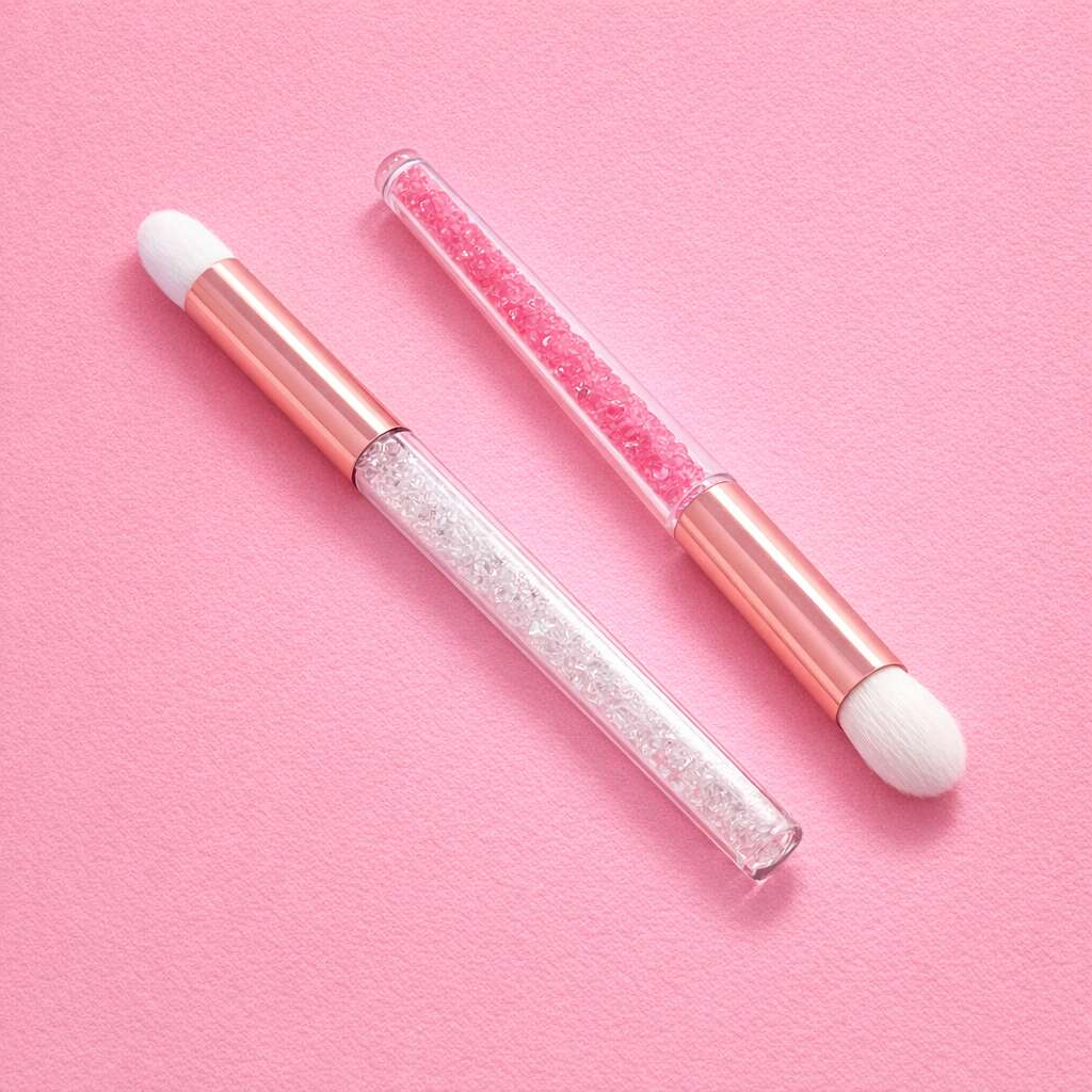 Pink makeup brush set with glitter handles, featuring a dual-ended design and soft white bristles, perfect for cosmetics.