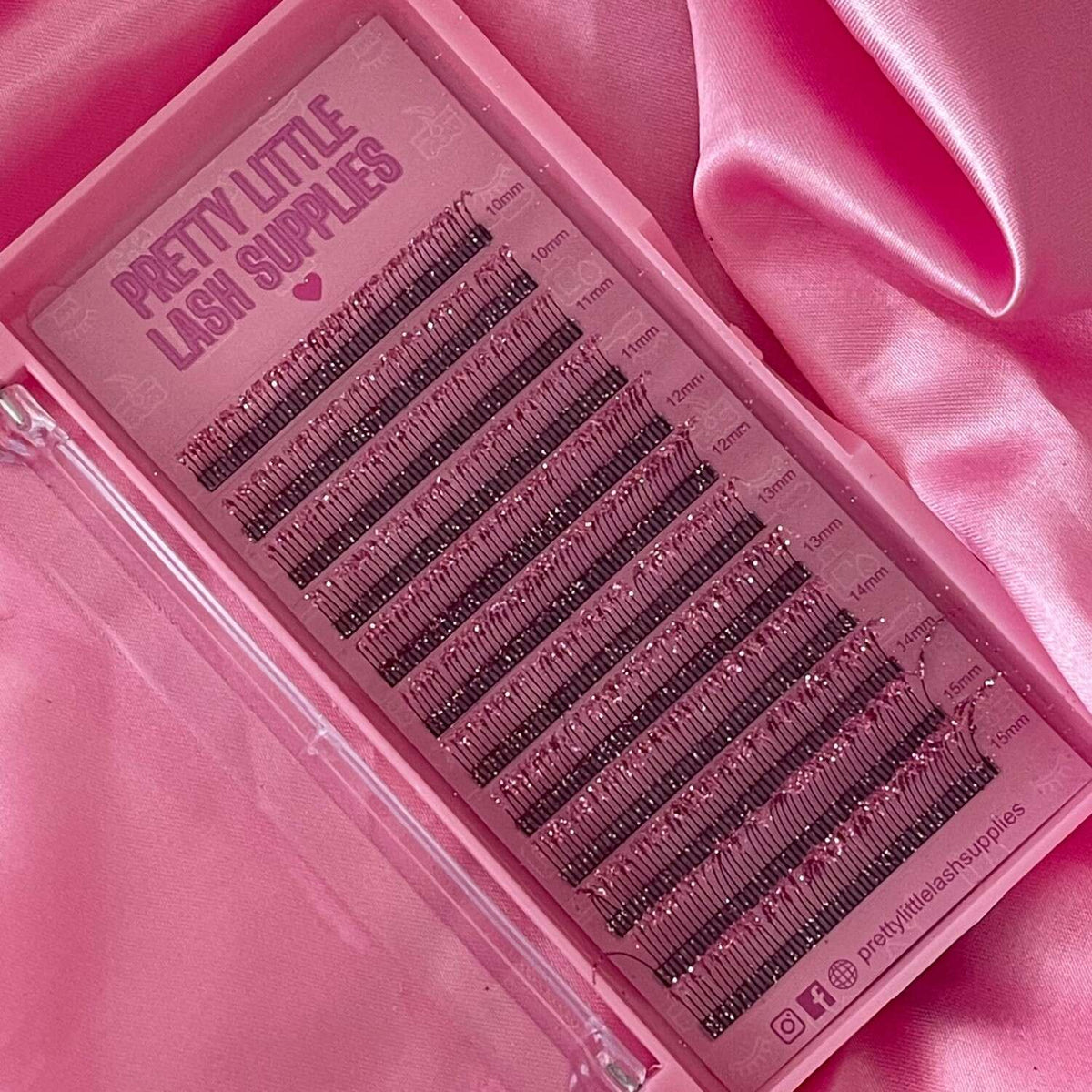 Pretty Little Lash Supplies 16-row mink eyelash extensions in various lengths, displayed on a pink tray.
