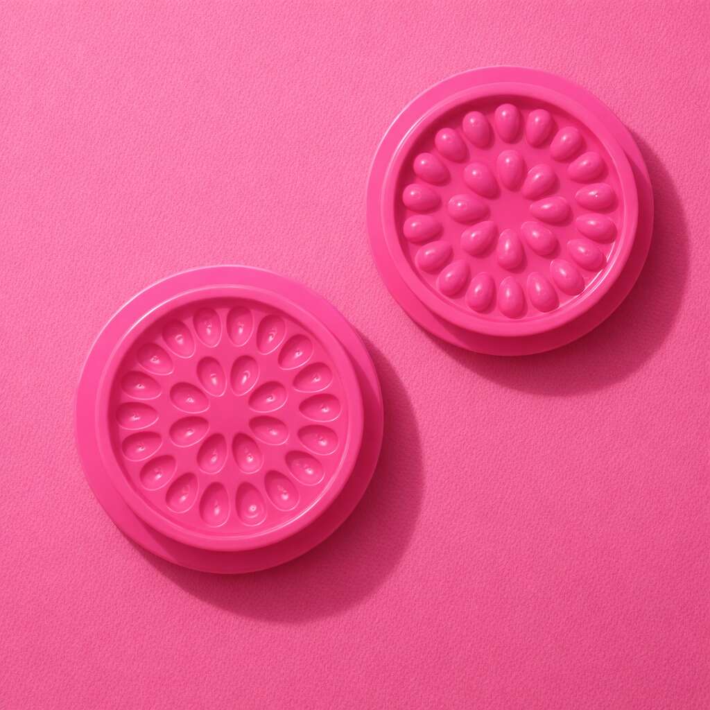 Bright pink silicone baking molds with floral designs, perfect for creating fun desserts and treats.