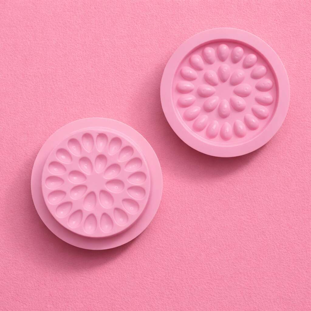 Pink silicone mold set with floral design, perfect for baking and crafting. Durable and flexible for easy use.