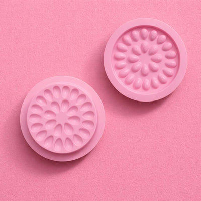Pink silicone mold set with floral design, perfect for baking and crafting. Durable and flexible for easy use.