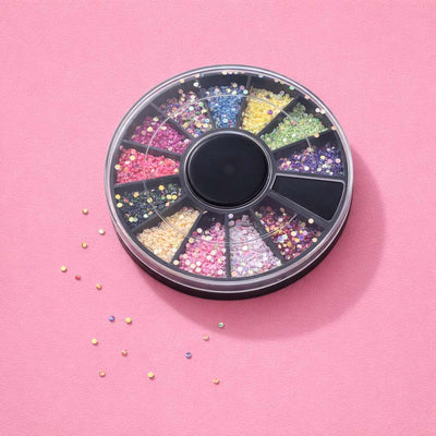 Multi-color crystal gems in a round container, featuring pink, purple, blue, and yellow shades, perfect for crafting.