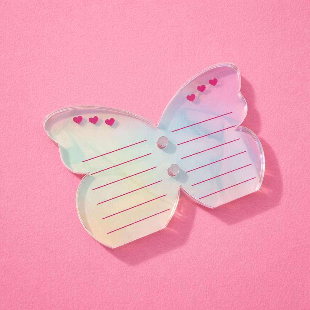 Iridescent butterfly-shaped sticky notes with pink hearts and lines, perfect for organizing and adding flair.