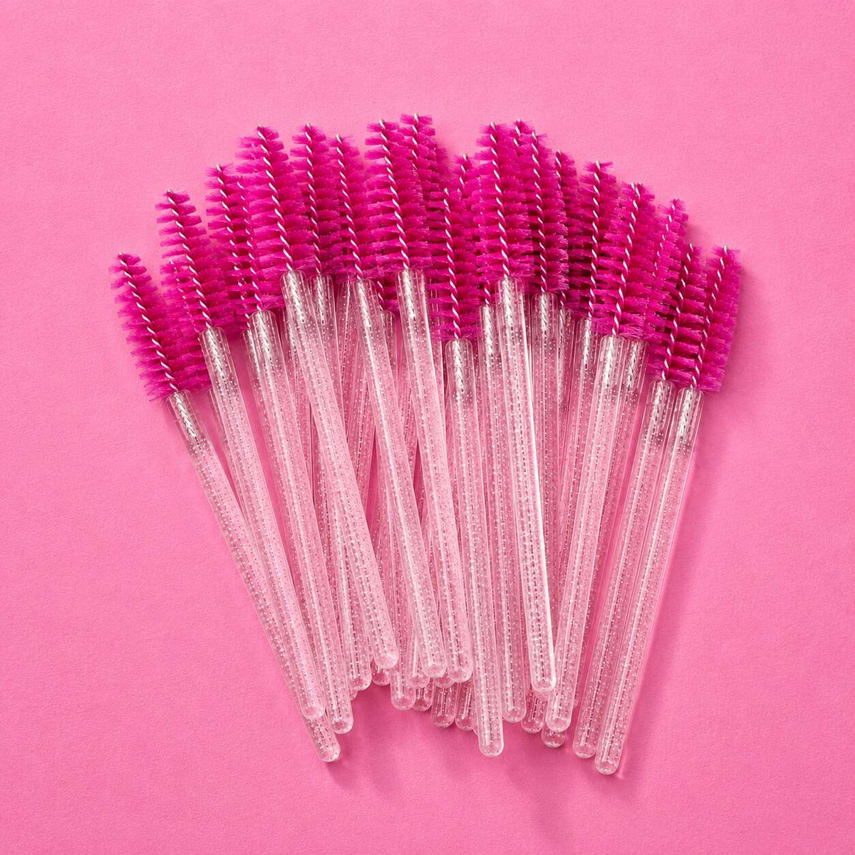 Set of 20 pink mascara wands with clear handles for precise makeup application and grooming.
