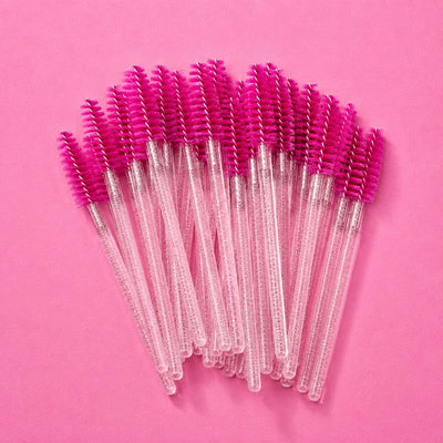 Set of 20 pink mascara wands with clear handles for precise makeup application and grooming.