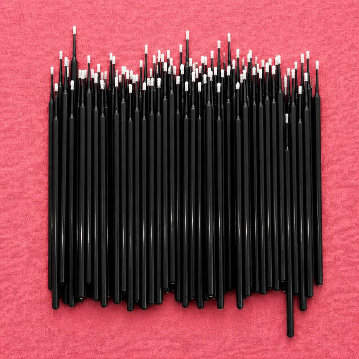 Black craft sticks with white tips, perfect for DIY projects and art supplies.