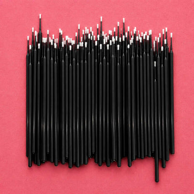 Black craft sticks with white tips, perfect for DIY projects and art supplies.