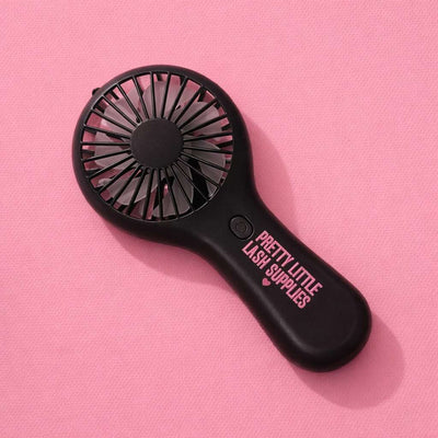 Black handheld fan with "Pretty Little Lash Supplies" text, ideal for lash extensions and beauty applications.