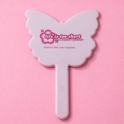 White butterfly-shaped cosmetic mirror with pink branding, perfect for applying false lashes.