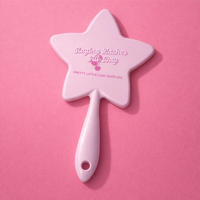 Pink star-shaped cosmetic mirror with a smooth handle, ideal for eyelash extension application.