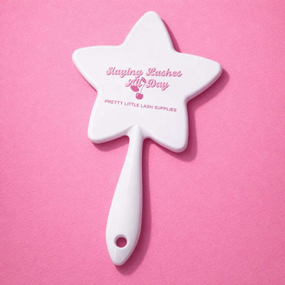 White star-shaped cosmetic mirror with "Slaying Lashes All Day" print in pink, perfect for beauty enthusiasts.