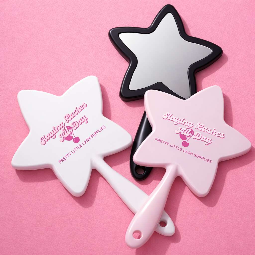 Star-shaped handheld mirrors in pink, white, and black with "Slaying Lashes All Day" print, perfect for beauty lovers.