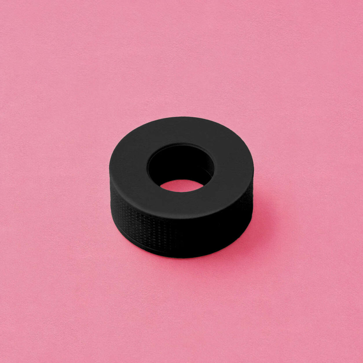 Black silicone grip ring with a textured surface, perfect for enhancing comfort and control in various applications.