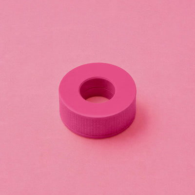 Hot pink silicone tape roll on a pastel pink background, ideal for crafts and home repairs.