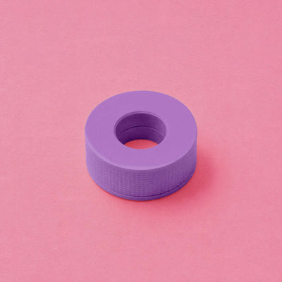 Purple silicone ring holder with a textured surface for secure grip, ideal for organizing rings and small accessories.