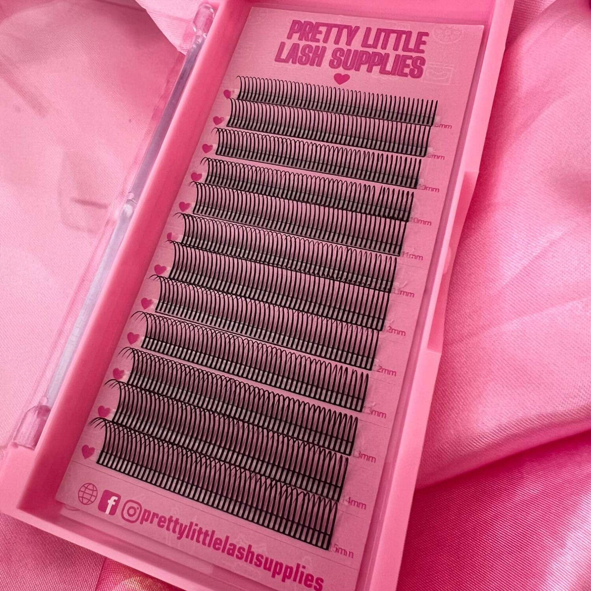 Pretty Little Lash Supplies black eyelash extensions in a pink case, featuring various lengths from 8mm to 15mm.