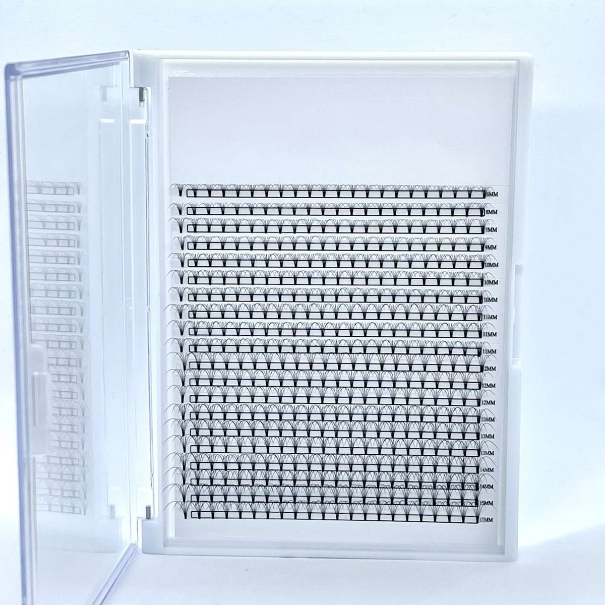 A white storage box containing 10 rows of black eyelash extension practice strips. Ideal for beauty professionals.