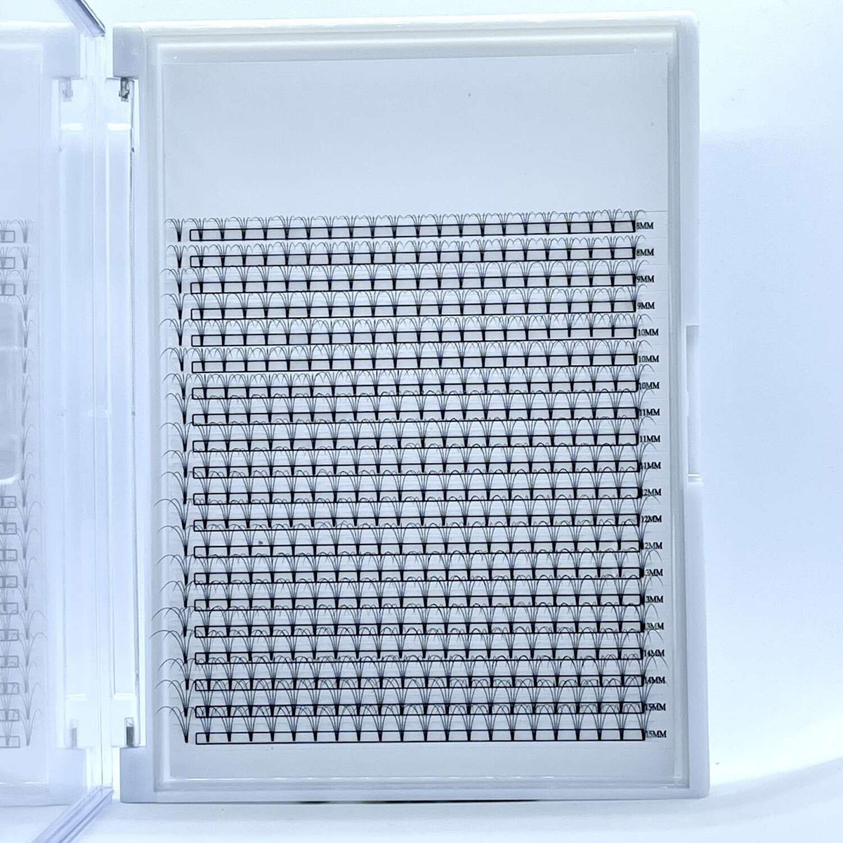 White plastic storage case containing a grid of black and white, numbered labels for organization and crafting.